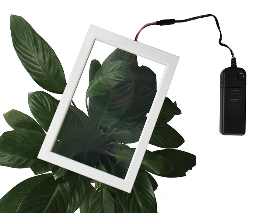 SGV smart film glass sample in white frame - clear state with portable power supply
