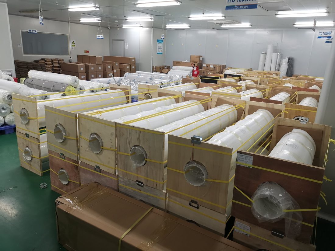 Warehouse with smart film rolls packed in wooden crates