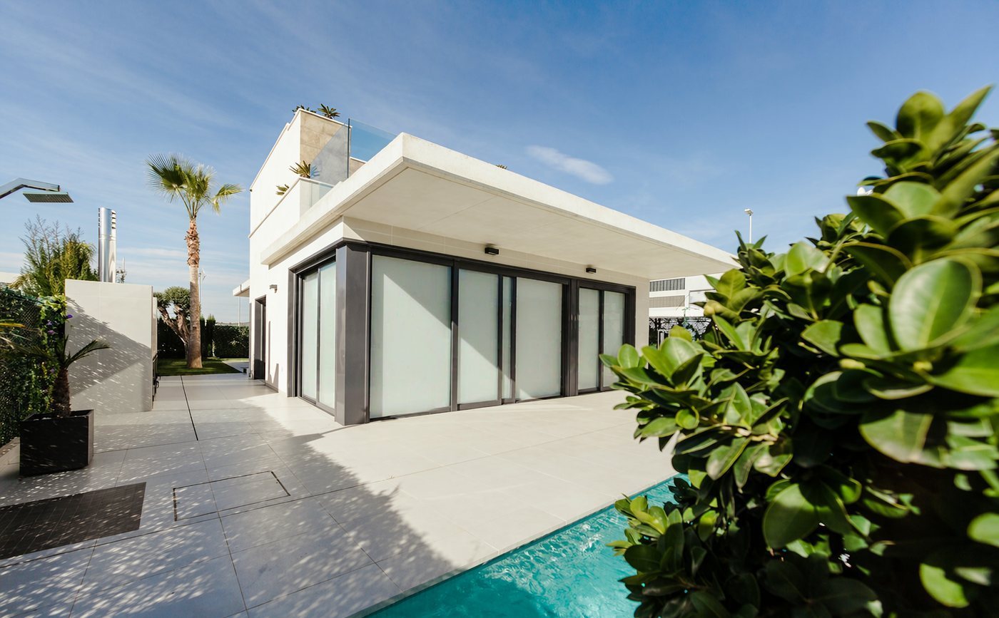 Modern villa with floor-to-ceiling smart glass sliding doors - opaque state (power off)